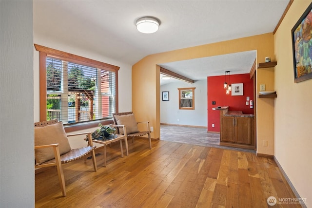 2526 19th St, Bremerton, WA 98312 - living area with light wood-style flooring, vaulted ceiling, healthy amount of natural light, and baseboards