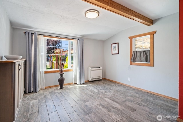 2526 19th St, Bremerton, WA 98312 - unfurnished living room with heating unit, wood finished floors, and baseboards
