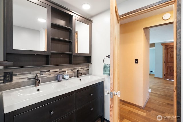 2526 19th St, Bremerton, WA 98312 - full bath featuring backsplash, wood finished floors, double vanity, and baseboards