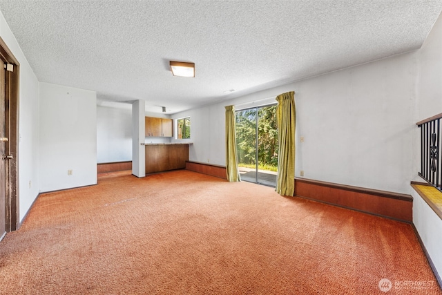 1015 143rd St S, Tacoma, WA 98444 - unfurnished living room featuring carpet floors and a textured ceiling