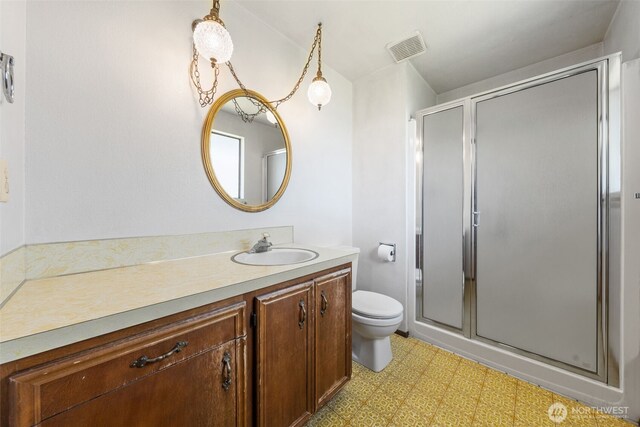 1015 143rd St S, Tacoma, WA 98444 - bathroom featuring tile patterned floors, toilet, vanity, and a stall shower