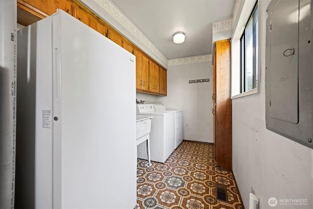 1119 Sunset Ave, Bellingham, WA 98226 - washroom featuring cabinet space, separate washer and dryer, electric panel, and light floors