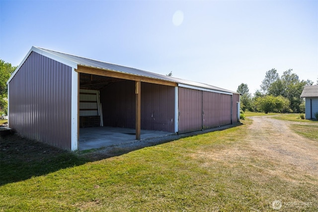 1119 Sunset Ave, Bellingham, WA 98226 - view of pole building featuring a lawn and a carport