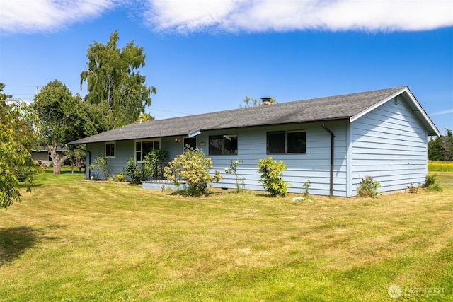 1119 Sunset Ave, Bellingham, WA 98226 - rear view of house featuring a yard, a chimney, and roof with shingles