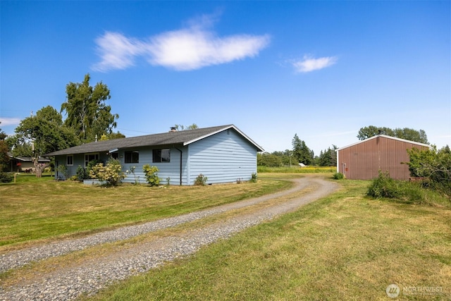 1119 Sunset Ave, Bellingham, WA 98226 - view of property exterior featuring driveway and a yard