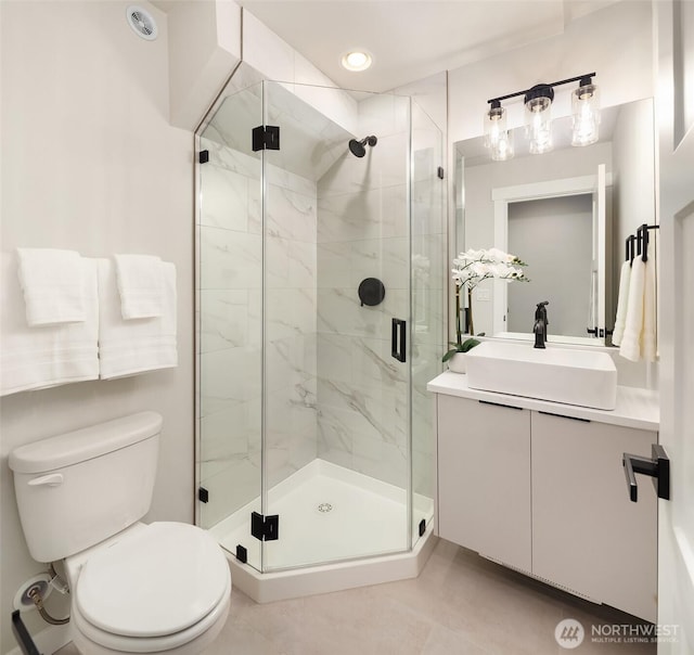 19722 Filbert Dr Unit A-3, Bothell, WA 98012 - bathroom featuring toilet, vanity, and a marble finish shower