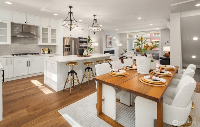 19722 Filbert Dr Unit A-3, Bothell, WA 98012 - dining space with recessed lighting, light wood finished floors, and a chandelier