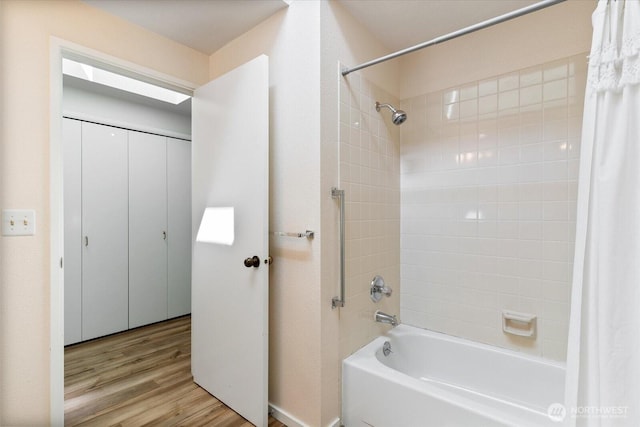8225 212th St SW # 302, Edmonds, WA 98026 - full bathroom featuring shower / bath combo with shower curtain and wood finished floors
