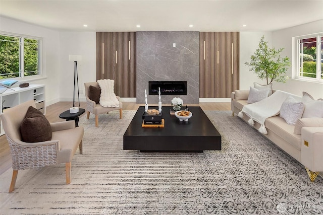 6202 122nd Ave SE, Bellevue, WA 98006 - living room featuring healthy amount of natural light, recessed lighting, a fireplace, and wood finished floors