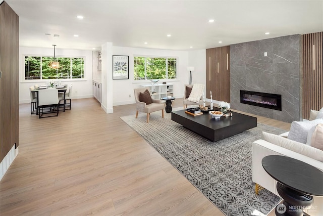 6202 122nd Ave SE, Bellevue, WA 98006 - living area featuring light wood-style floors, recessed lighting, and a high end fireplace