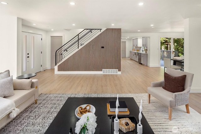 6202 122nd Ave SE, Bellevue, WA 98006 - living area featuring light wood finished floors, stairway, and recessed lighting