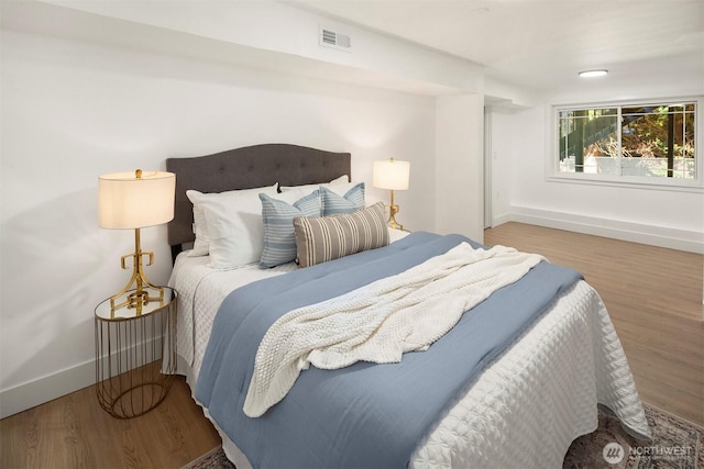 6202 122nd Ave SE, Bellevue, WA 98006 - bedroom featuring baseboards and wood finished floors