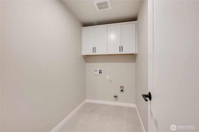 5842 186th Pl SW, Lynnwood, WA 98037 - washroom featuring hookup for an electric dryer, washer hookup, cabinet space, baseboards, and gas dryer hookup