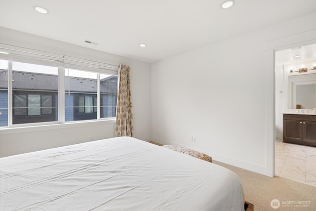 26627 NE Boyd Way Unit 101, Duvall, WA 98019 - bedroom featuring light marble finish floors, recessed lighting, baseboards, and connected bathroom