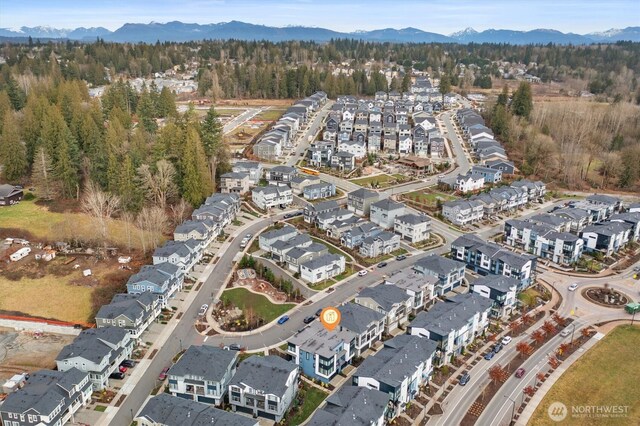 26627 NE Boyd Way Unit 101, Duvall, WA 98019 - aerial view of property's location with a mountainous background and nearby suburban area