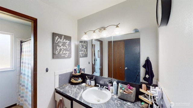 504 Ash St N, Omak, WA 98841 - bathroom with vanity and a shower with shower curtain