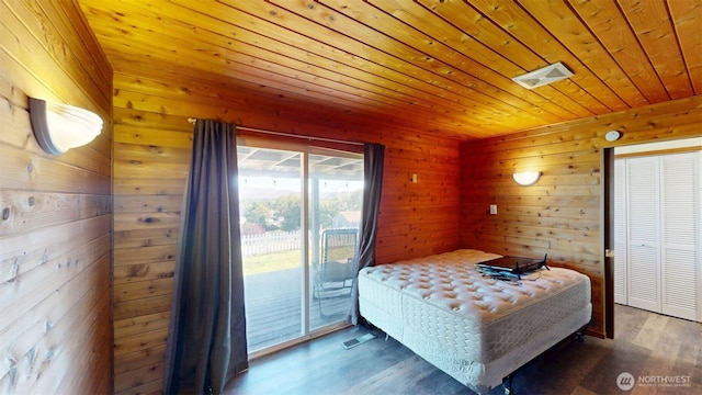 504 Ash St N, Omak, WA 98841 - bedroom featuring access to outside, wood ceiling, wood finished floors, wood walls, and a closet