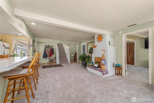 3256 S 360th St, Auburn, WA 98001 - living area with carpet flooring, stairs, recessed lighting, and a brick fireplace
