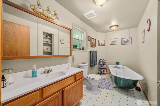 3256 S 360th St, Auburn, WA 98001 - bathroom with a freestanding bath, vanity, tile patterned floors, and toilet