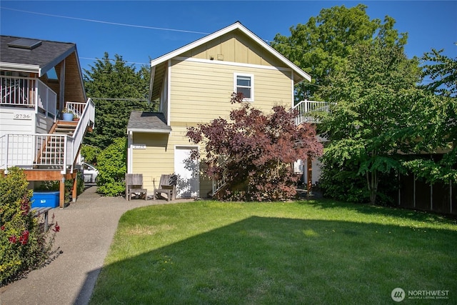 2730-2734 Nevada St, Bellingham, WA 98226 - back of house with a lawn, board and batten siding, and stairs