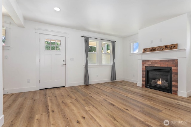2730-2734 Nevada St, Bellingham, WA 98226 - unfurnished living room featuring light wood-style floors, baseboards, a fireplace, and recessed lighting