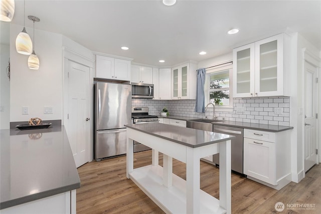 2730-2734 Nevada St, Bellingham, WA 98226 - kitchen with appliances with stainless steel finishes, a sink, dark countertops, backsplash, and recessed lighting