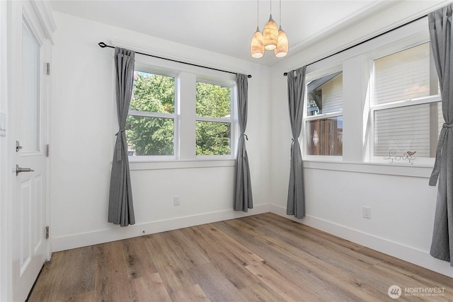 2730-2734 Nevada St, Bellingham, WA 98226 - spare room featuring baseboards, a chandelier, and light wood finished floors