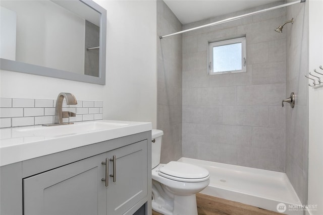 2730-2734 Nevada St, Bellingham, WA 98226 - bathroom with toilet, vanity, decorative backsplash, and tiled shower