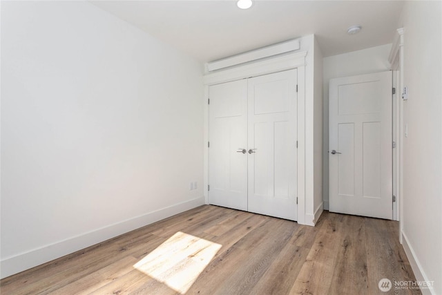 2730-2734 Nevada St, Bellingham, WA 98226 - unfurnished bedroom featuring wood finished floors, baseboards, and a closet