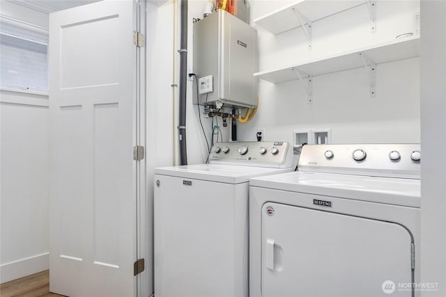 2730-2734 Nevada St, Bellingham, WA 98226 - laundry area featuring tankless water heater, washer and clothes dryer, and light wood finished floors