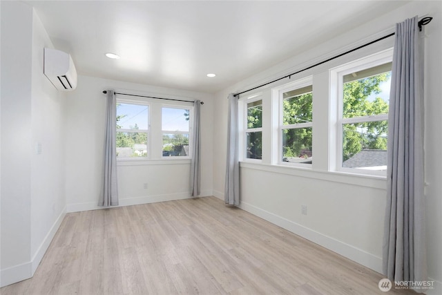 2730-2734 Nevada St, Bellingham, WA 98226 - unfurnished room with a wall mounted AC, light wood-style flooring, baseboards, and recessed lighting