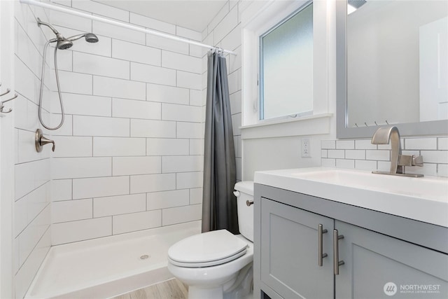 2730-2734 Nevada St, Bellingham, WA 98226 - bathroom with toilet, vanity, a tile shower, and backsplash