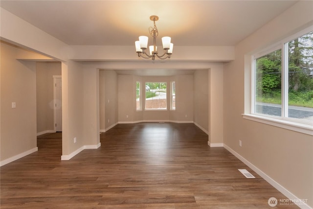 31823 44th Ave S, Auburn, WA 98001 - unfurnished dining area featuring a chandelier, baseboards, and dark wood-style floors