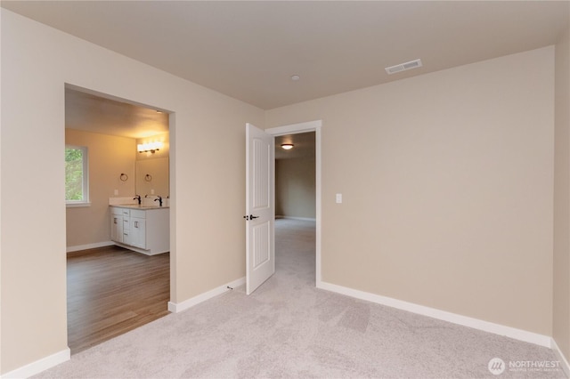 31823 44th Ave S, Auburn, WA 98001 - spare room featuring light colored carpet and baseboards