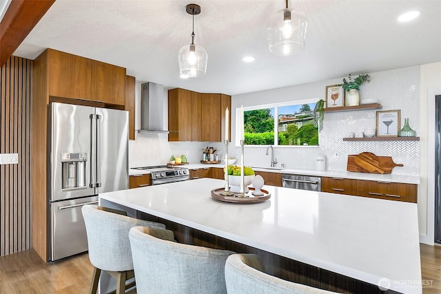 5942 Beverly Ave NE, Tacoma, WA 98422 - kitchen featuring stainless steel appliances, brown cabinets, wall chimney range hood, modern cabinets, and light countertops