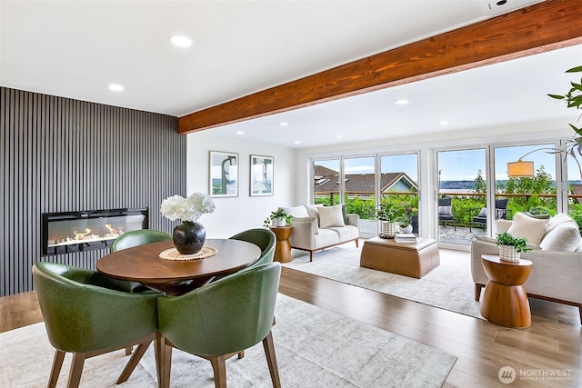 5942 Beverly Ave NE, Tacoma, WA 98422 - dining room with wood finished floors, beamed ceiling, recessed lighting, and a glass covered fireplace