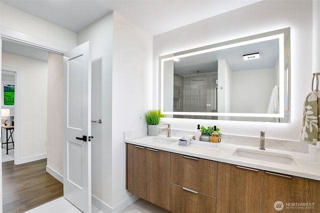 5942 Beverly Ave NE, Tacoma, WA 98422 - full bath featuring double vanity, tiled shower, wood finished floors, and baseboards