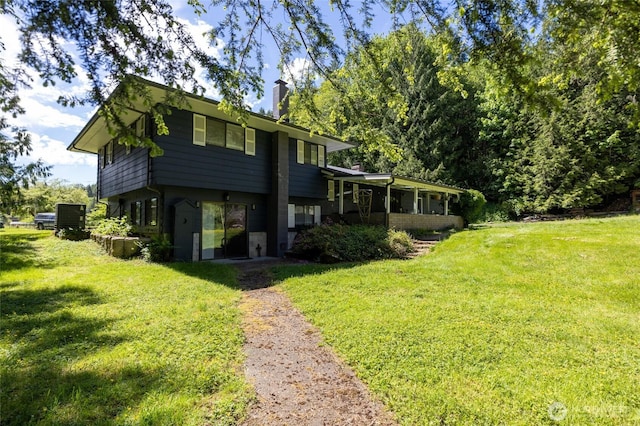 371 Pigeon Springs Rd, Onalaska, WA 98570 - view of front of property featuring a chimney and a front yard