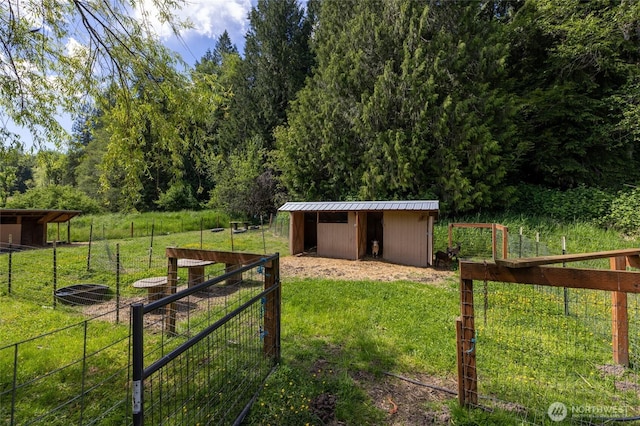 371 Pigeon Springs Rd, Onalaska, WA 98570 - view of yard featuring an outbuilding and an exterior structure