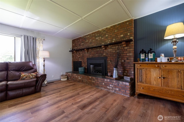 371 Pigeon Springs Rd, Onalaska, WA 98570 - living area with a fireplace, wood finished floors, and baseboards
