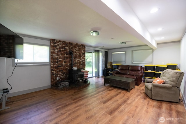 371 Pigeon Springs Rd, Onalaska, WA 98570 - living room featuring a wood stove, wood finished floors, and baseboards