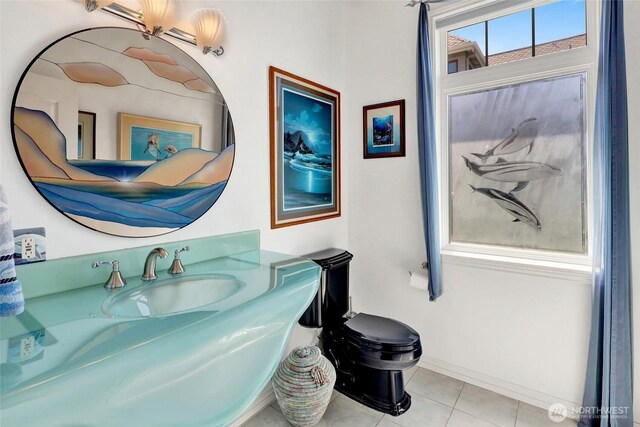 10903 Samish Beach Ln, Bow, WA 98232 - half bathroom featuring tile patterned flooring, toilet, vanity, and baseboards