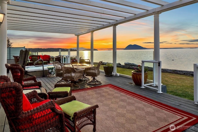 10903 Samish Beach Ln, Bow, WA 98232 - patio terrace at dusk featuring a pergola and a deck with water view