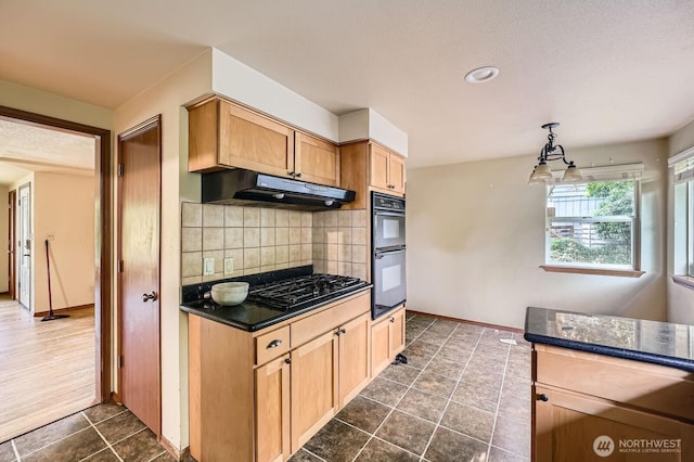 1001 Fairway Dr, Fircrest, WA 98466 - kitchen featuring under cabinet range hood, dark countertops, black appliances, tasteful backsplash, and baseboards