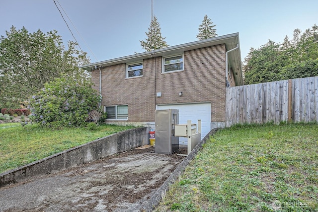 1001 Fairway Dr, Fircrest, WA 98466 - rear view of property featuring an attached garage and driveway