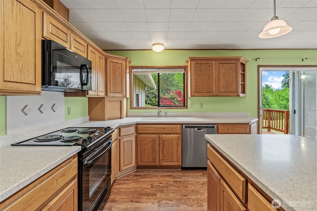 1086 W State Route 4, Skamokawa, WA 98647 - kitchen featuring black appliances, light countertops, and wood finished floors