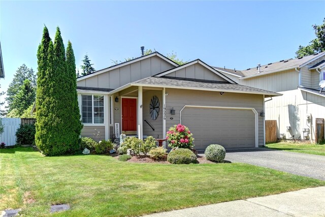 19226 12th Avenue Ct E, Spanaway, WA 98387 - single story home with board and batten siding, a garage, driveway, and roof with shingles