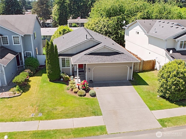 19226 12th Avenue Ct E, Spanaway, WA 98387 - view of front of house featuring an attached garage, driveway, a residential view, and roof with shingles