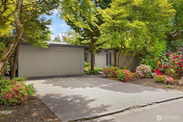 7633 NE 123rd St, Kirkland, WA 98034 - view of front of property featuring concrete driveway and a garage