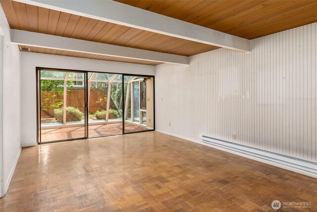 7633 NE 123rd St, Kirkland, WA 98034 - empty room with baseboard heating and a wooden ceiling with exposed beams